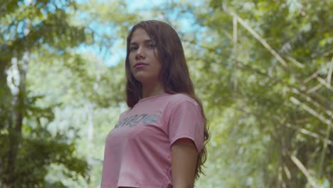 sexy venezuelan girl enjoying the island destination of trinidad with leaves and trees in the background