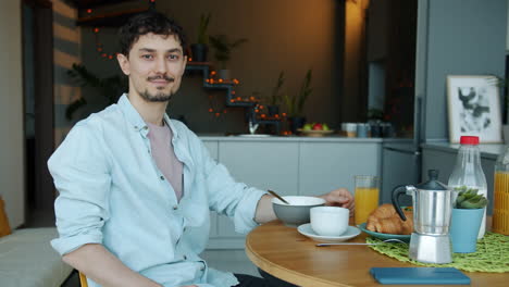 man enjoying breakfast at home