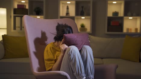 The-young-woman-who-presses-the-pillows-on-her-head-with-fear.