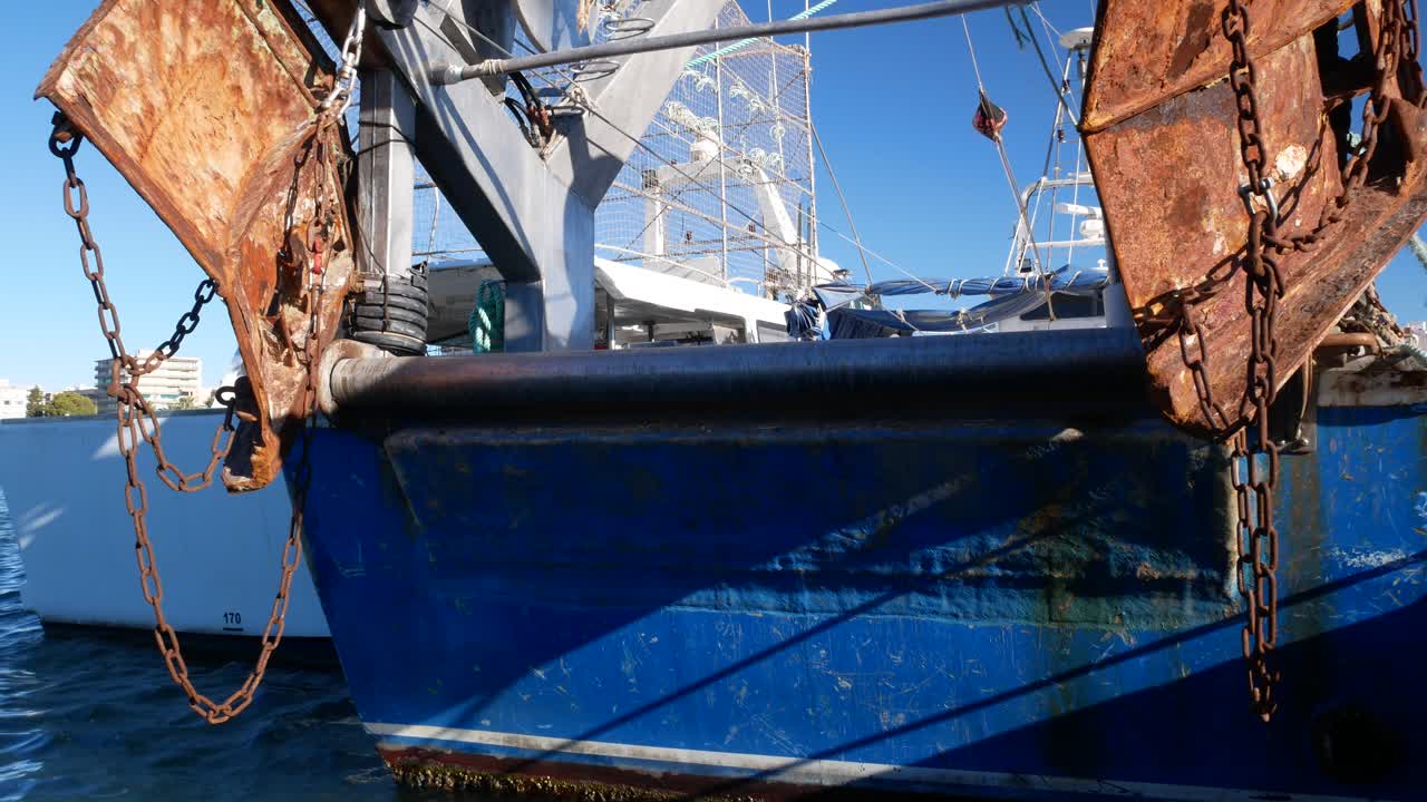 Rear view of a fishing boat docked in the port
