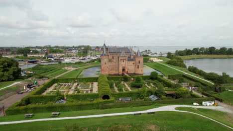 muiderslot castle: aerial view traveling in towards the beautiful castle and where you can see the port and the channels that surround it