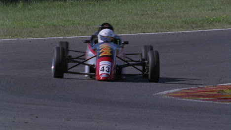 formula cars race on a circuit track 2