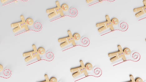 gingerbread men and candy canes on a white background vertical