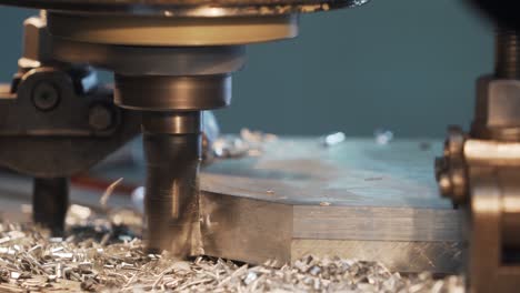 Milling machine in operation cutting steel in a high-tech machineshop