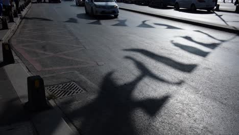 silhouettes of traffic and vehicles flowing under the pleasant shadows of flags or pennants in istanbul