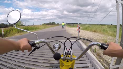 Driving-over-animal-protection-on-a-old-moped