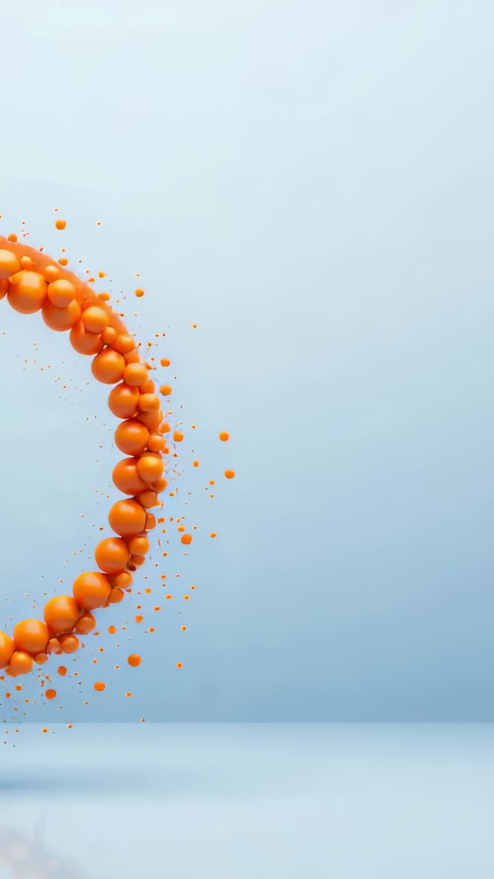 Video verticale: movimento dopo l'entrata, anello arancione di perline che si avvicina all'obiettivo sul set, perdendo goccioline