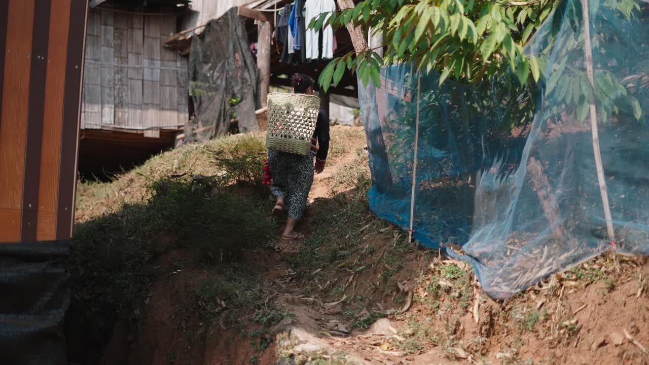 A person walking through a rural village