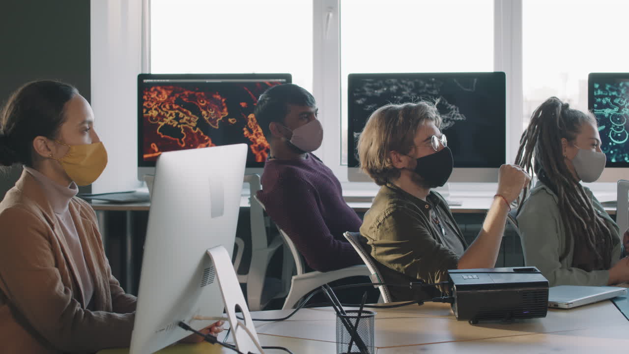 Business Meeting in a Modern Office with Masks