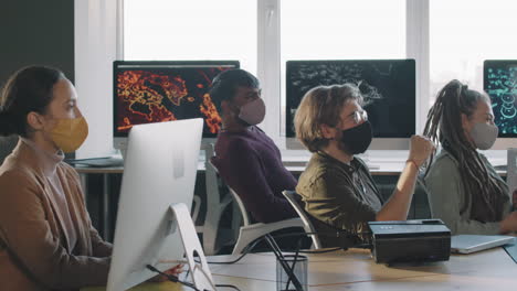 business meeting in a modern office with masks