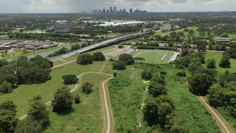 reverse reveal over city park with the city of new orleans in the background