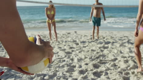 Friends-playing-beach-volleyball