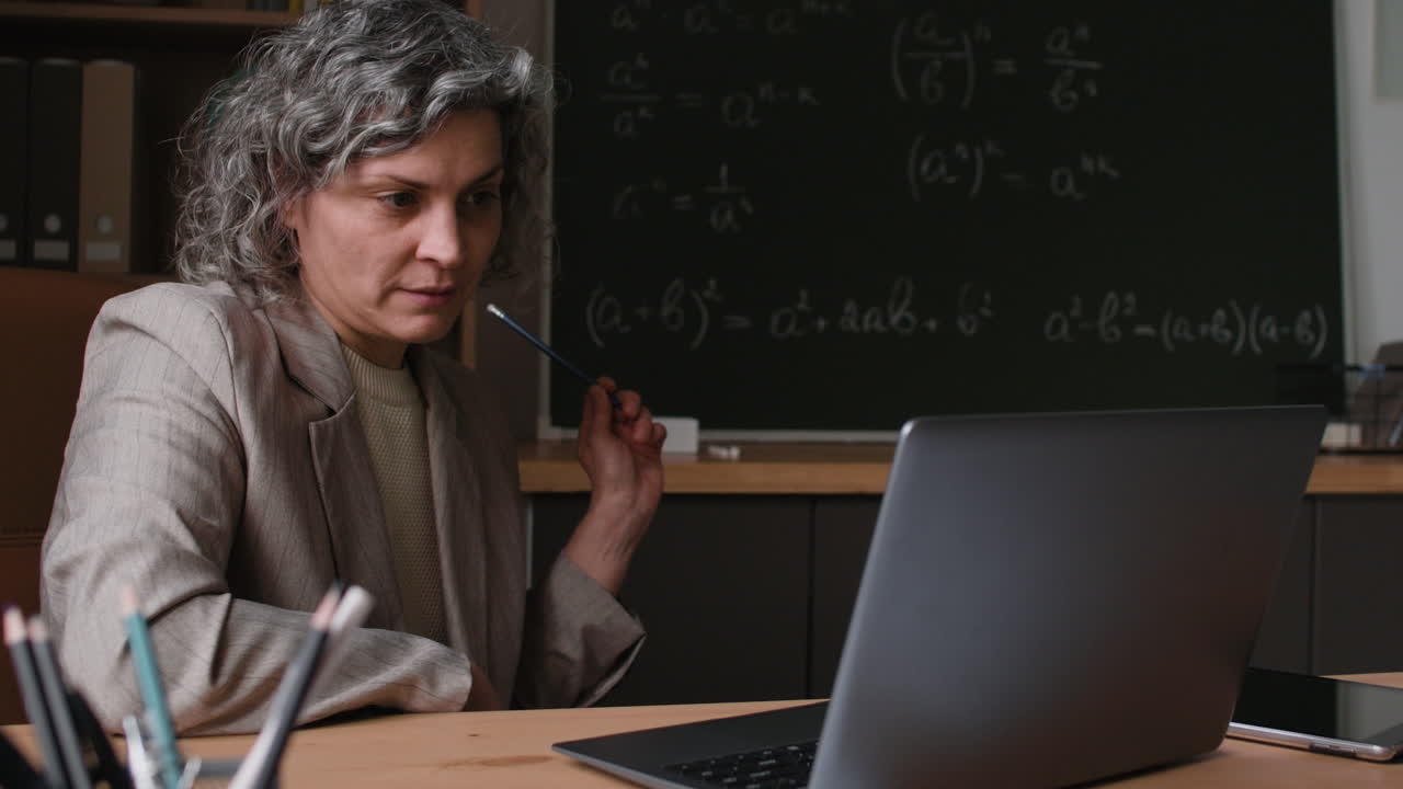 Female Teacher Giving Online Math Lesson