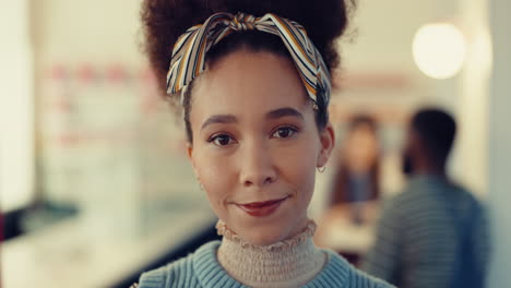 smile, face and young woman in a coffee shop