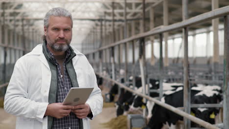 portrait of male supervisor at cattle farm