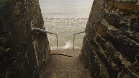 concrete stairs leading into the ocean