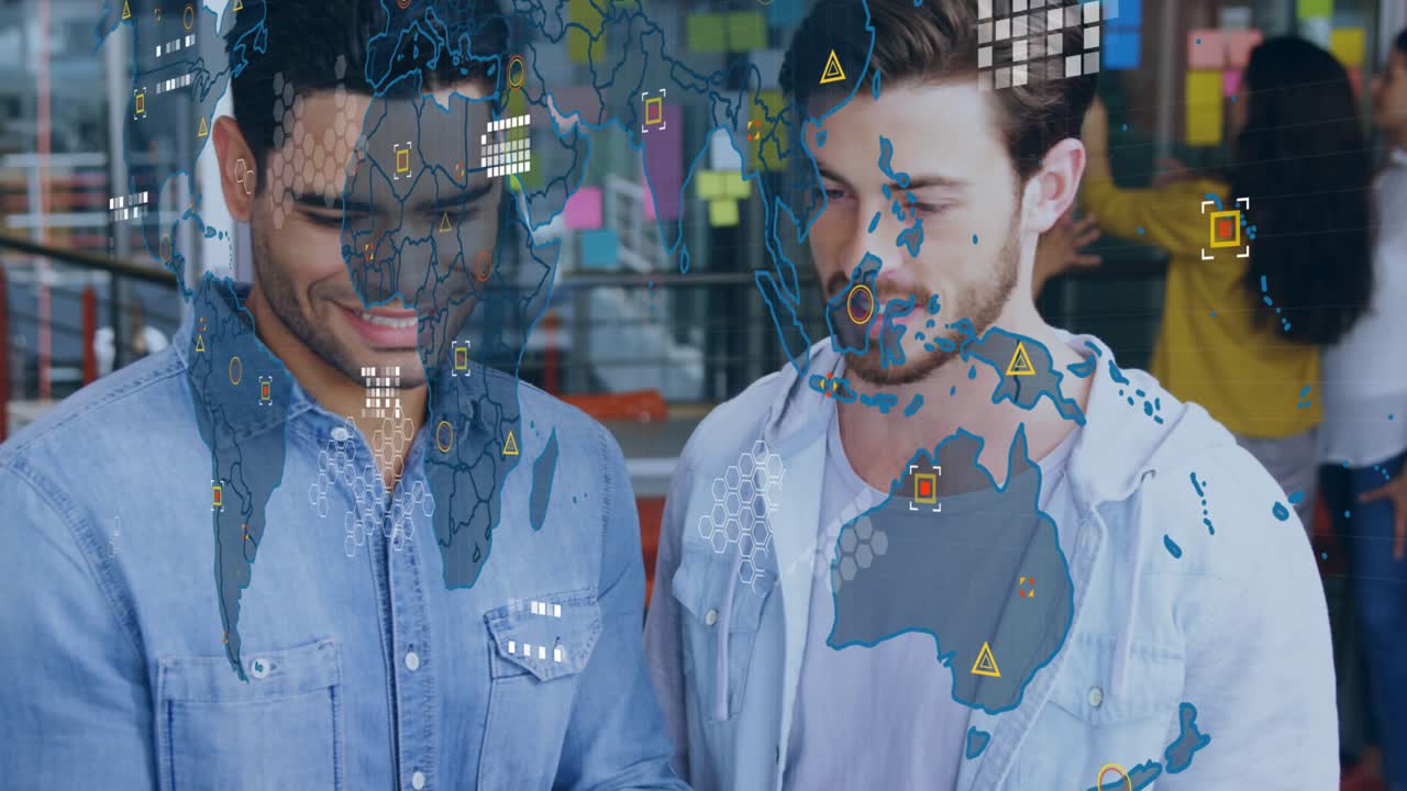 Two data analysts scrolling laptop trackpad in office animating world map overlay for insights