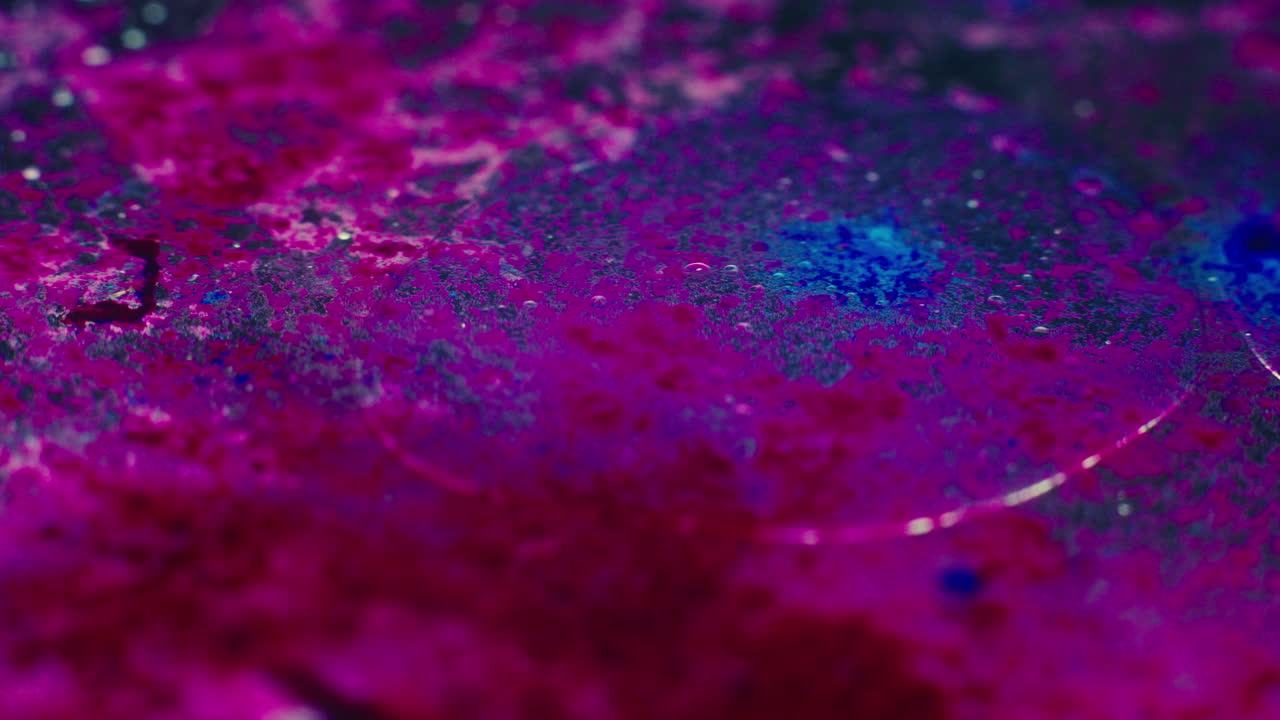 Colourful, organic, liquids macro shots buzzing and flowing