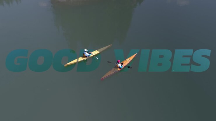 Animation of good vibes text over happy people outdoors