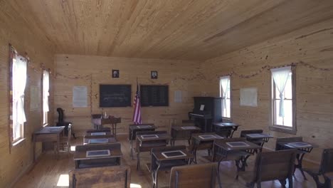 establishing shot of a rustic classroom in the west