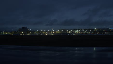 buildings in a city lit up at night