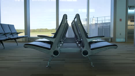 shot of empty chairs at airport during covid-19 pandemic