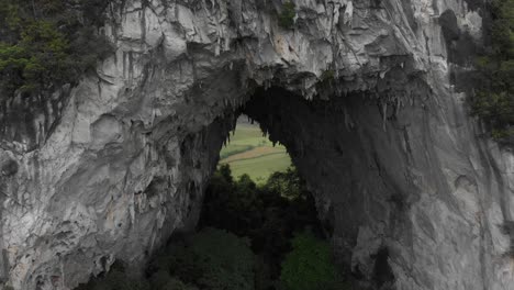 Close-up-shot-of-big-whole-at-Nui-Thung-mountain-at-Vietnam,-aerial