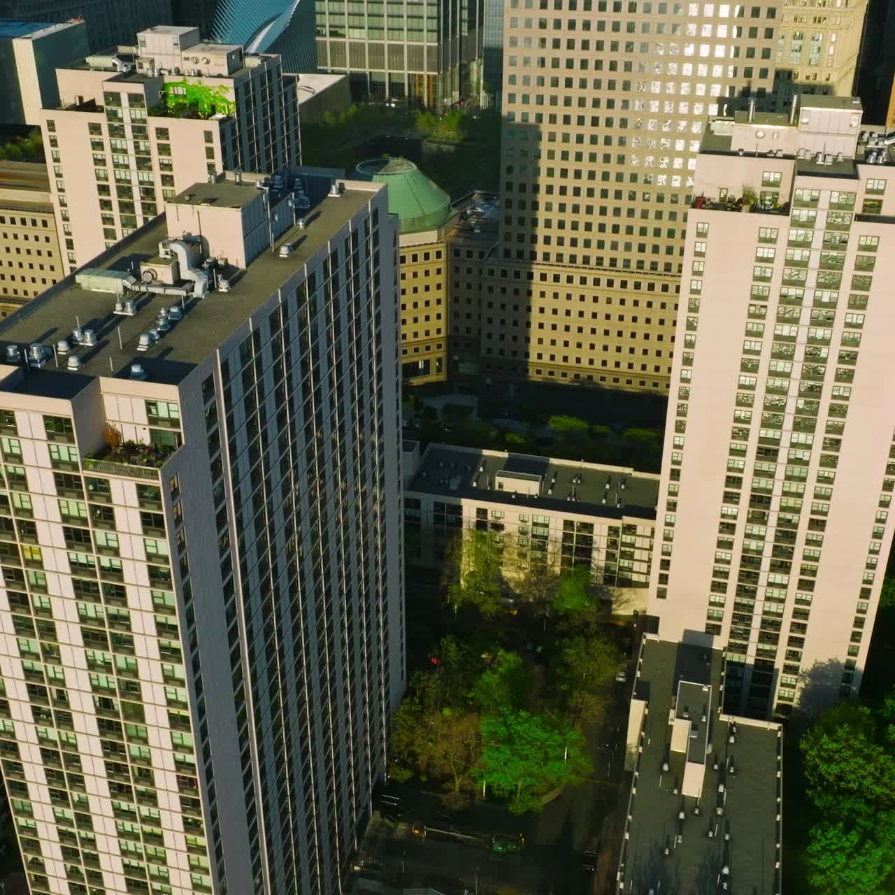 Multi-storied building and skyscrapers of New York city. Top view on the residential area with green streets
