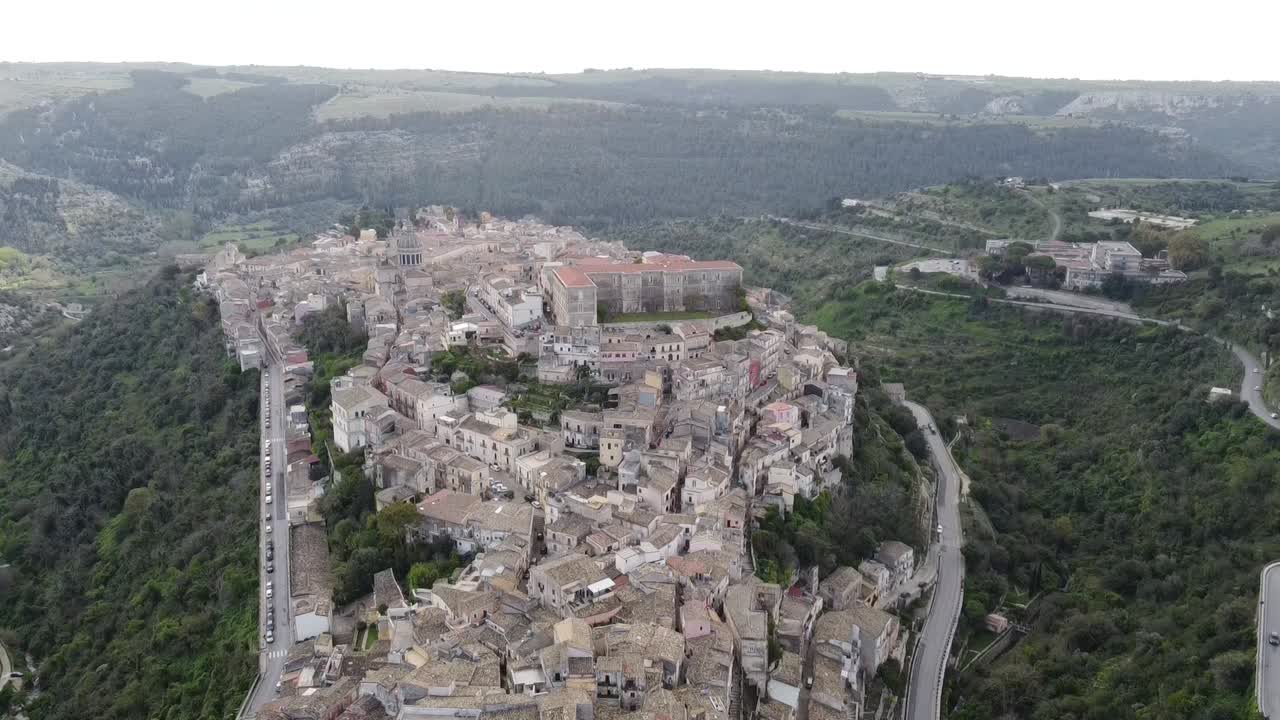 spectacular drone view over the old town of ragusa in sicily (italy), smooth movement