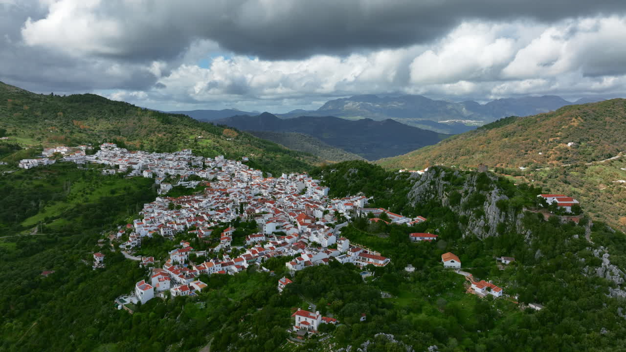 Beautiful cinematic drone view of Gaucín City in the mountains of Spain, Europe. Cloud shadows are covering mountains around. Poin of interest camera movement. High quality 4K prores footage.