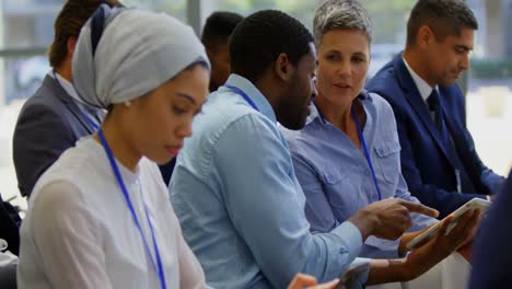 Multi-ethnic-business-people-attending-a-business-seminar-4k