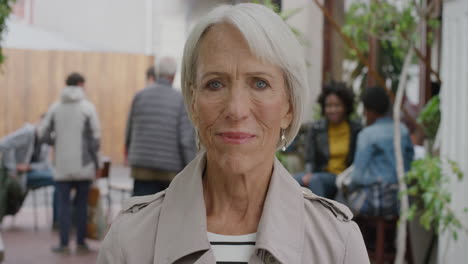 portrait-of-elderly-business-woman-smiling-looking-at-camera-elegant-middle-aged-female-in-urban-outdoors