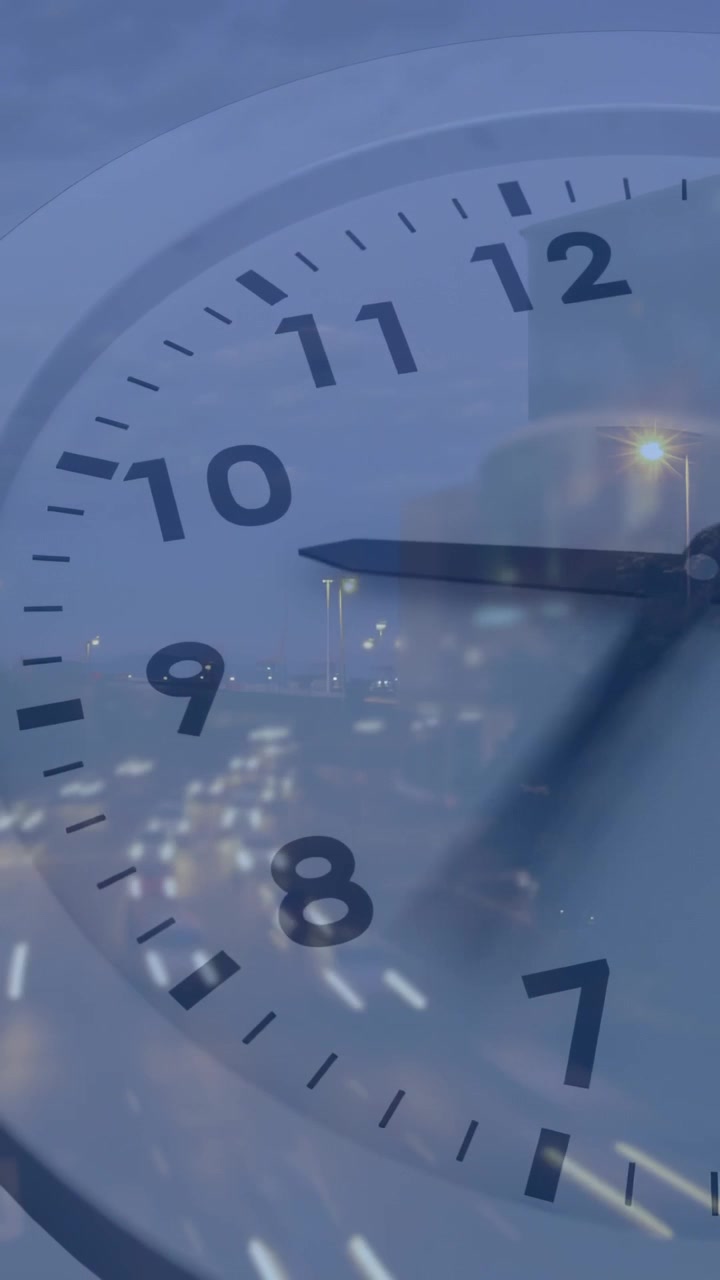 Vertical video: Clock overlay starting hands rotating clockwise, city lights shifting, showing time