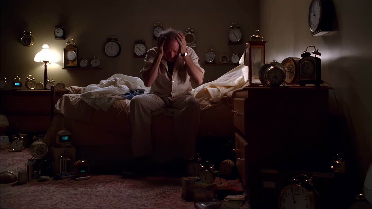 Man Overwhelmed by Numerous Clocks in a Bedroom