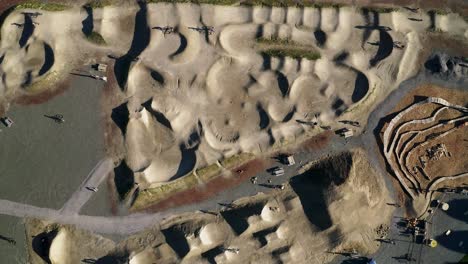 Aerial-Of-Waterfront-Pump-Track-Bike-Park-On-Sunny-Day-Near-Kulshan-Trackside-Beer-Garden-In-Bellingham,-Washington