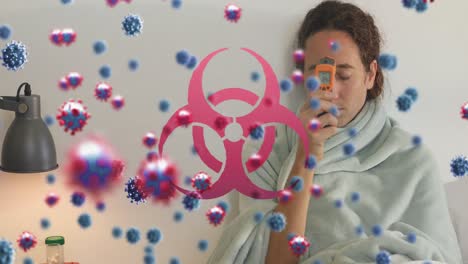 Animation-of-virus-cells-and-biohazard-symbol-over-caucasian-woman-lying-in-bed