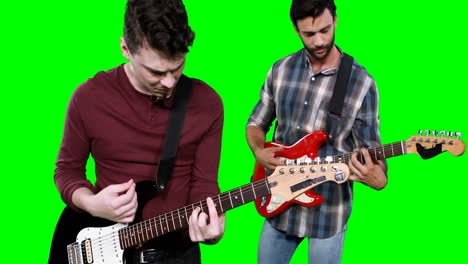 male musicians playing guitar