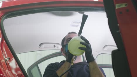 professional car cleaning. сar wash. interior detailing. dry clean and detail a car interior. deep cleaning of the car body and seats. wiping foam in car wash. cleaning the car panel from dust. a vacuum cleaner