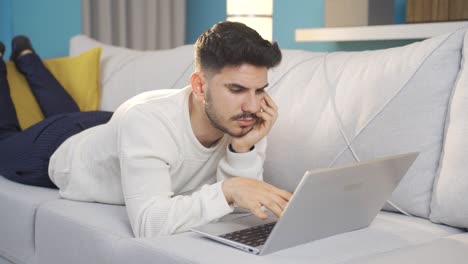 Young-man-surprised-by-what-happened-on-laptop.