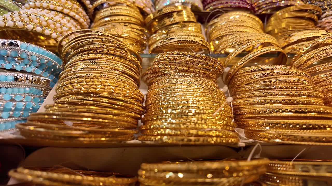 Rows of gold bangles on display