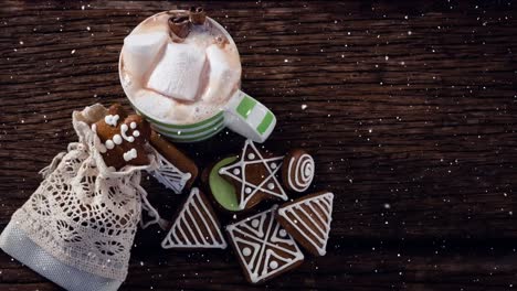 falling snow with christmas hot chocolate and cookies