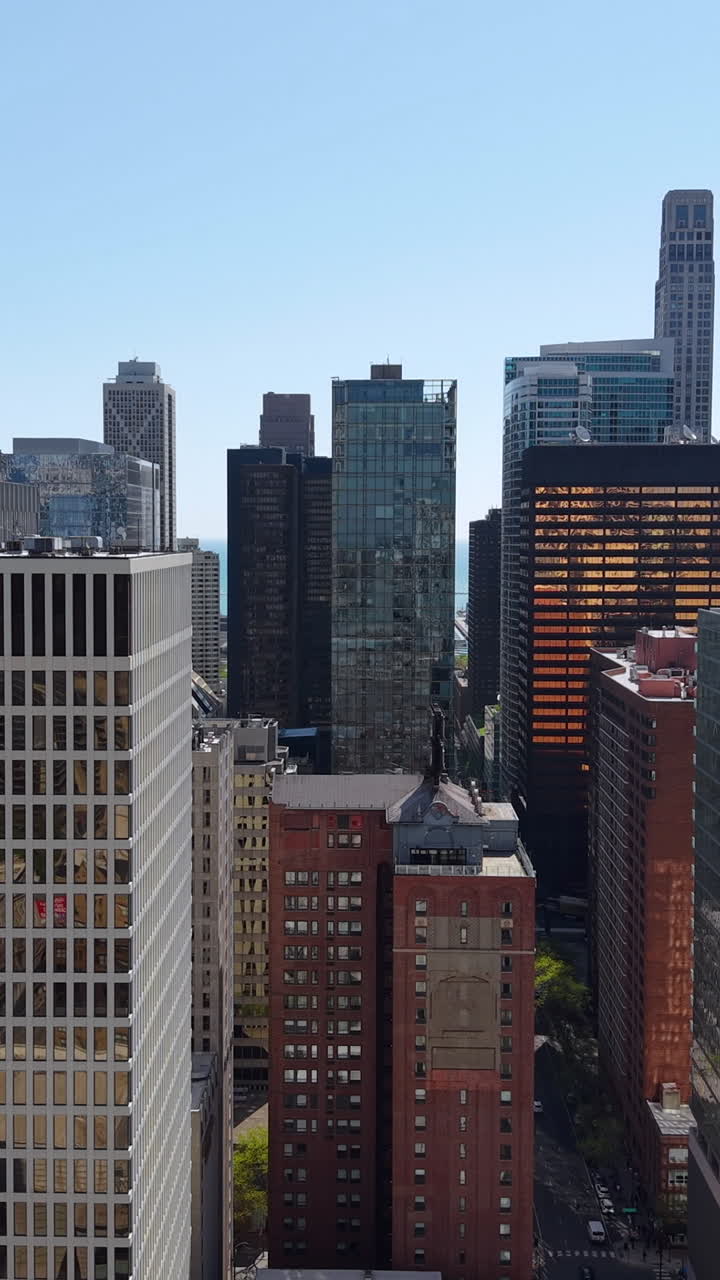 Chicago USA, Vertical Drone Shot of Modern Downtown Towers and Skyscrapers on Sunny Day
