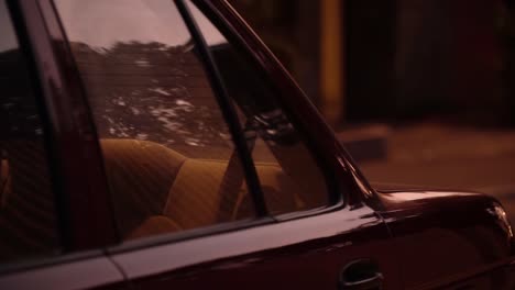 Rear-seat-of-an-old-car-at-night-in-La-Molina,-Lima,-Peru