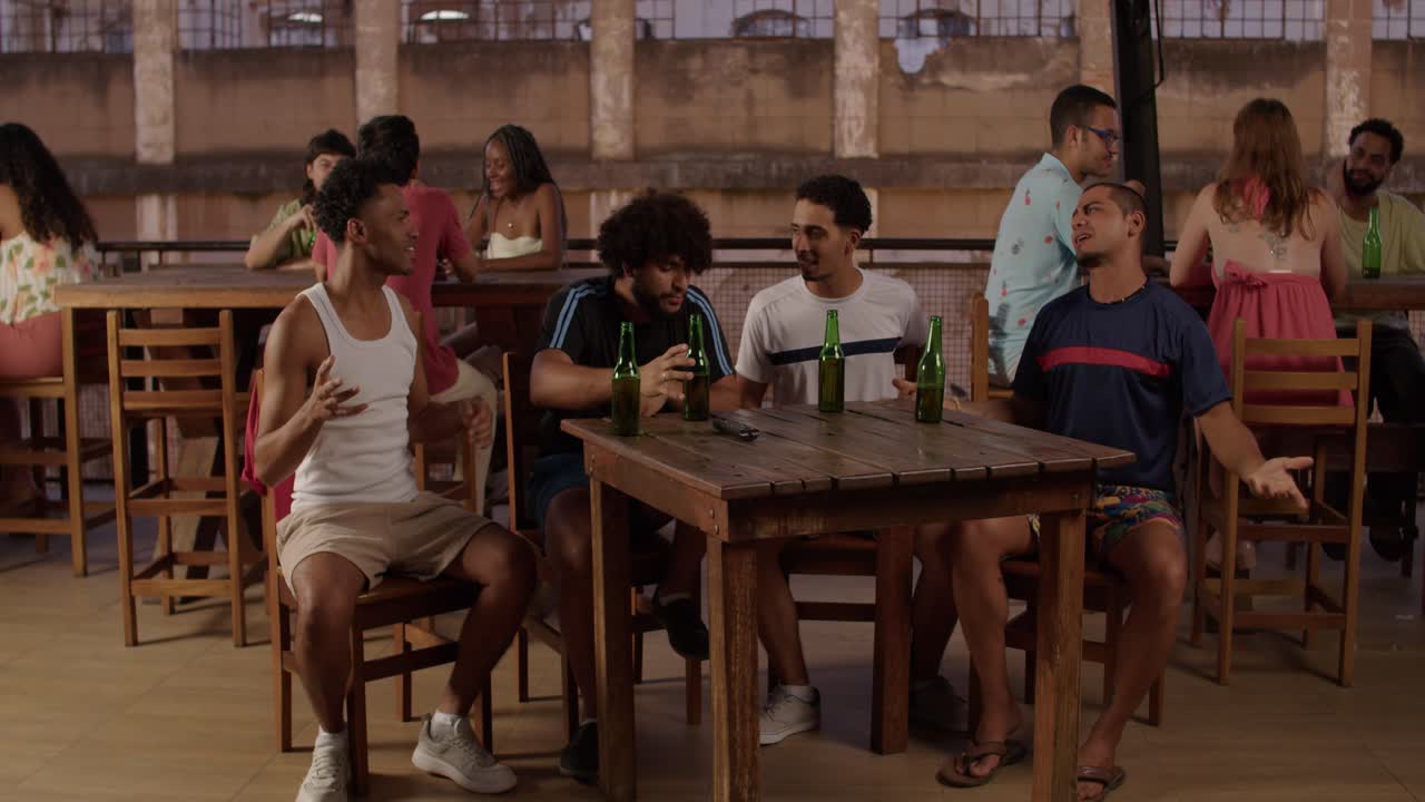 Friends Socializing and Drinking at an Outdoor Bar