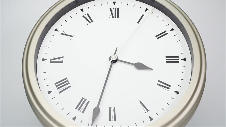 Time lapse silver wall clock show the at 4 o'clock.