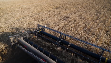 Combined Wheat Thresher Roller Working On The Fields. High Angle Shot