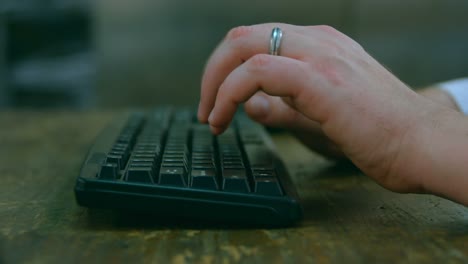 Close-up-of-robotic-engineer-working-at-desk-4k