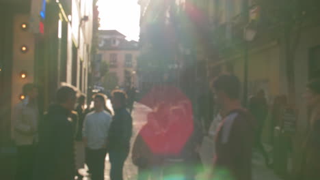 pedestrian street with walking people view in sunlight