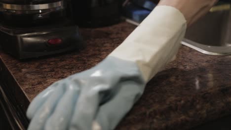 Wiping-The-Wet-Kitchen-Countertop-With-A-Damp-Cloth---Close-Up-Shot