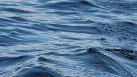 close up of waves in a lake in slow motion